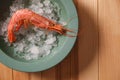 Fresh royal shrimp with ice on table, top view