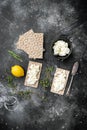 Fresh rye crispbreads with cream cheese, on black dark stone table background, top view flat lay, with copy space for text Royalty Free Stock Photo