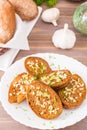 Fresh rye garlic croutons with dill on a plate and buns