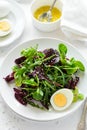 Fresh salad with beetroot, mix leaves, olive oil, egg and sesame seeds Royalty Free Stock Photo