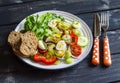 Fresh salad with cherry tomatoes, cucumbers, sweet peppers, celery and quail eggs. Royalty Free Stock Photo