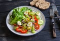 Fresh salad with cherry tomatoes, cucumbers, sweet peppers, celery and quail eggs. Royalty Free Stock Photo