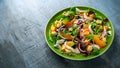 Fresh salad with chicken breast, peach, red onion, croutons and vegetables in a green plate. healthy food Royalty Free Stock Photo