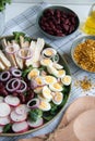Fresh salad with chicken, red beans, cucumber, radish, eggs and onion Royalty Free Stock Photo