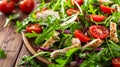 Fresh salad with chicken, tomatoes, and mixed greens on wooden background, close-up Healthy eating