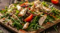 Fresh salad with chicken, tomatoes, and mixed greens on wooden background, close-up Healthy eatin