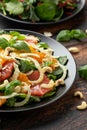 Fresh salad with fennel, orange, grapefruit, spinach and cashew nuts. healthy food. Royalty Free Stock Photo