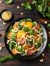 Fresh salad with fennel, orange, grapefruit, spinach and cashew nuts. healthy food. Royalty Free Stock Photo