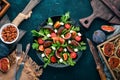 Fresh salad with figs, arugula leaves, cherry tomatoes and feta cheese. Free space for text.