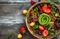 Fresh salad with fruit,berry and vegetables.