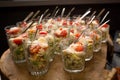 Fresh salad in glasses. Starter appetizer table. Banquet or event in cafe. Holiday or event treats. Catering food