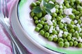 Fresh salad of green peas, goat cheese and herbs.