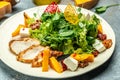 Fresh salad with grilled chicken fillet, feta cheese, caramelized pumpkin, superfood keto diet concept. Healthy, clean eating, top Royalty Free Stock Photo