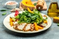 fresh salad with grilled chicken fillet, feta cheese, caramelized pumpkin, superfood keto diet concept. Healthy, clean eating, top Royalty Free Stock Photo