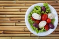 Fresh salad of heart of palm (palmito), cherry tomatos, olives Royalty Free Stock Photo
