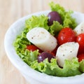 Fresh salad of heart of palm (palmito), cherry tomatos, olives Royalty Free Stock Photo