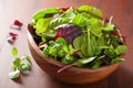 Fresh salad leaves in bowl: spinach, mangold, ruccola