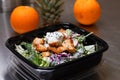 Fresh salad meal packed in a plastic container ready to eat - Healthy takeaway food and eating concept. Shot in a real healthy fas