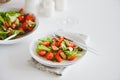 Fresh salad with mussels and tomatoes on white wooden table Royalty Free Stock Photo