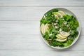 Fresh salad with pear on white wooden table, top view. Space for text Royalty Free Stock Photo