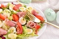 Fresh salad with quail eggs and prosciutto ham for Easter breakfast Royalty Free Stock Photo
