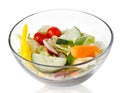 Fresh salad of raw vegetables in a glass bowl isolated on white background Royalty Free Stock Photo