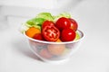 Fresh salad with raw vegetables and herbs. Basket with fresh fruits and vegetables isolated on white background. Healthy clean