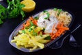 Fresh salad with sellery, apple, carrot with johurt on a metal plate on a grey background. Healthy eating concept