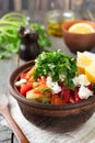 Fresh Salad Shopska of baked peppers, tomato, onion, cucumber, parsley, dill and feta cheese in a ceramic bowl. Traditional Royalty Free Stock Photo