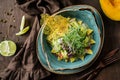 Fresh salad with sliced of turkey ham, mango, avocado, micro greens, lime in bowl on wooden background. Healthy food, dieting, top Royalty Free Stock Photo