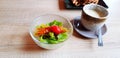 Fresh salad with small bowl of Japanese Steamed Egg on wooden table with copy space at restaurant Royalty Free Stock Photo