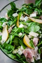 Fresh salad with spinach, pears and gorgonzola