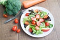 Fresh salad with strawberries, kiwi, tomatoes and apples Royalty Free Stock Photo