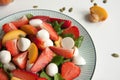 Fresh salad with strawberry, peach and mozzarella