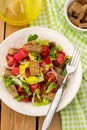 Salad with tomato, lettuce, onions and rye bread Royalty Free Stock Photo