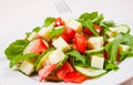 Fresh salad with tomatoes, arugula, cucumber and cheese cubes Royalty Free Stock Photo