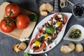 Fresh salad of tomatoes and mozzarella. Recipe with olive oil with red onion, olives and basil Royalty Free Stock Photo