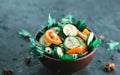 Fresh salad with vegetables on a black matte background. The concept of a healthy diet Royalty Free Stock Photo