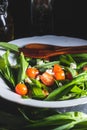 Fresh salad with wild garlic,tomatoes and feta cheese on plate