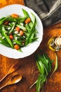 Fresh salad with wild garlic,tomatoes and feta cheese on plate