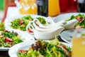 Fresh salads on the plates and sause Royalty Free Stock Photo