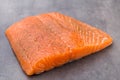 Fresh salmon fille with spice on the grey background. Royalty Free Stock Photo
