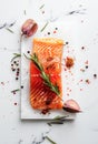 Fresh Salmon Fillet With Herbs and Spices on a White Marble Surface