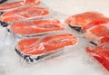 Fresh salmon fillet in plastic packing for sell in supermarket or seafood market. Royalty Free Stock Photo