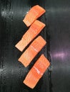 Fresh salmon fillet on dark background Royalty Free Stock Photo