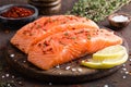 Fresh salmon fish fillet on wooden board Royalty Free Stock Photo