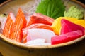 Fresh salmon fish slice with tuna set.Sushi Set Sashimi and sushi rolls served on black stone slate.Close Up. Royalty Free Stock Photo