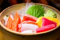 Fresh salmon fish slice with tuna set.Sushi Set Sashimi and sushi rolls served on black stone slate.Close Up. Royalty Free Stock Photo