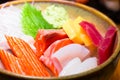 Fresh salmon fish slice with tuna set.Sushi Set Sashimi and sushi rolls served on black stone slate.Close Up. Royalty Free Stock Photo