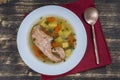 Fresh salmon fish soup with carrots and potatoes in a white plate, close up Royalty Free Stock Photo